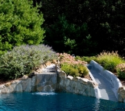 slide-pool-water-flowers-landscaping-fox-hollow-backyard-design
